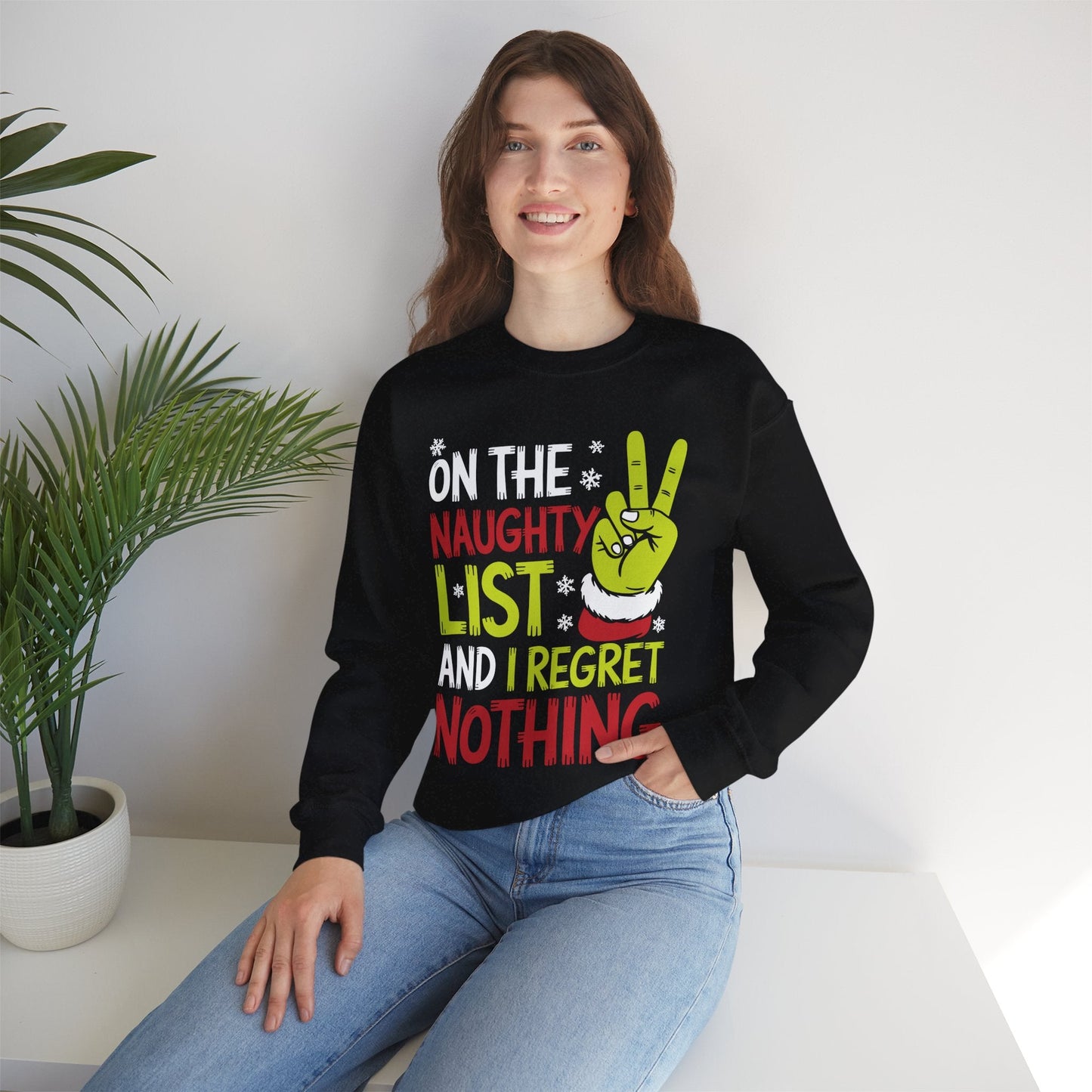 On The Naughty List And I Regret Nothing Funny Christmas Sweatshirt
