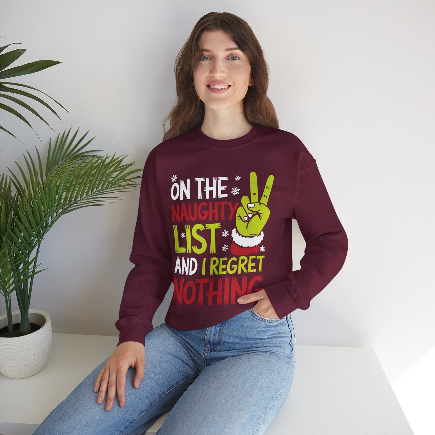On The Naughty List And I Regret Nothing Funny Christmas Sweatshirt